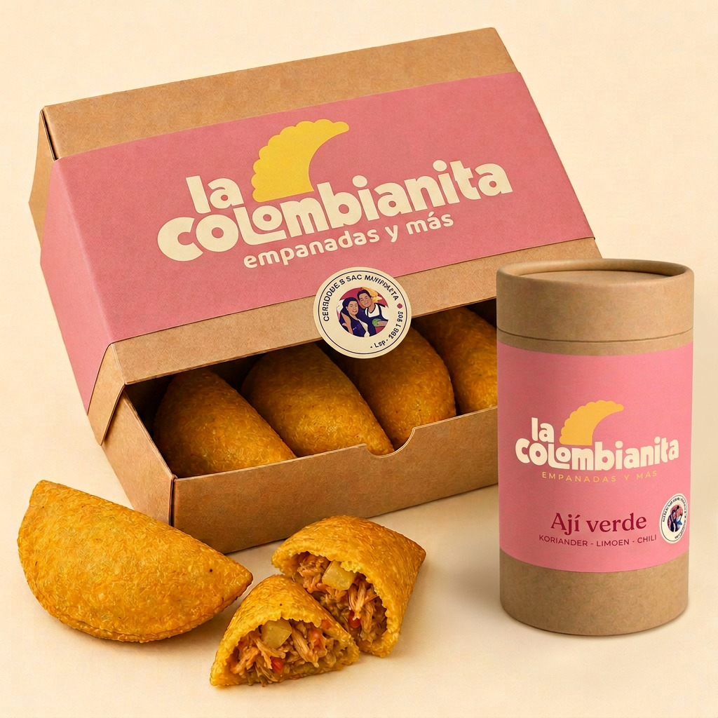 Half geopende kraft diepvriesdoos van La Colombianita met guava banderol, logo en empanadas, met een potje Ají verde ernaast